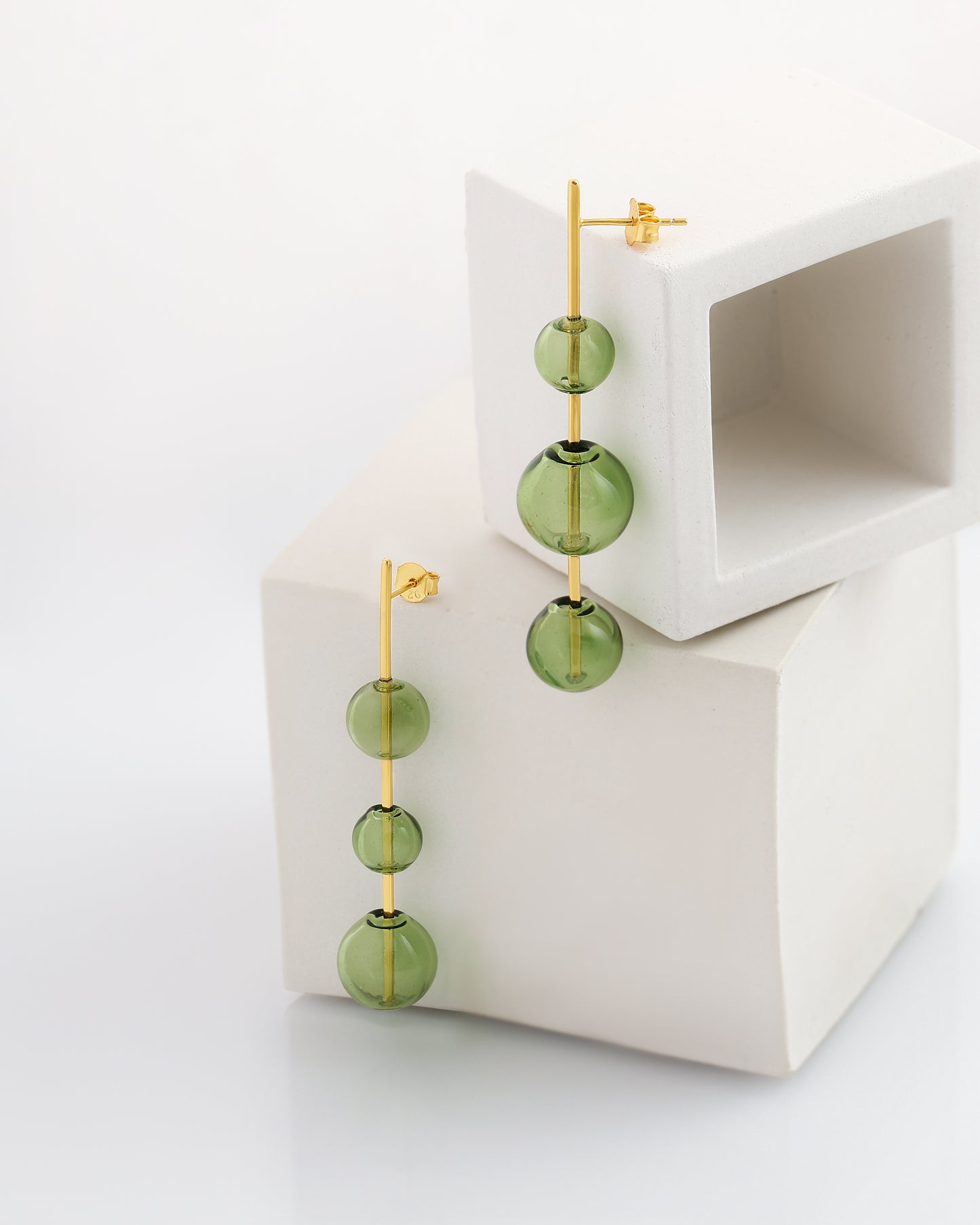 mismatched green glass stick studs