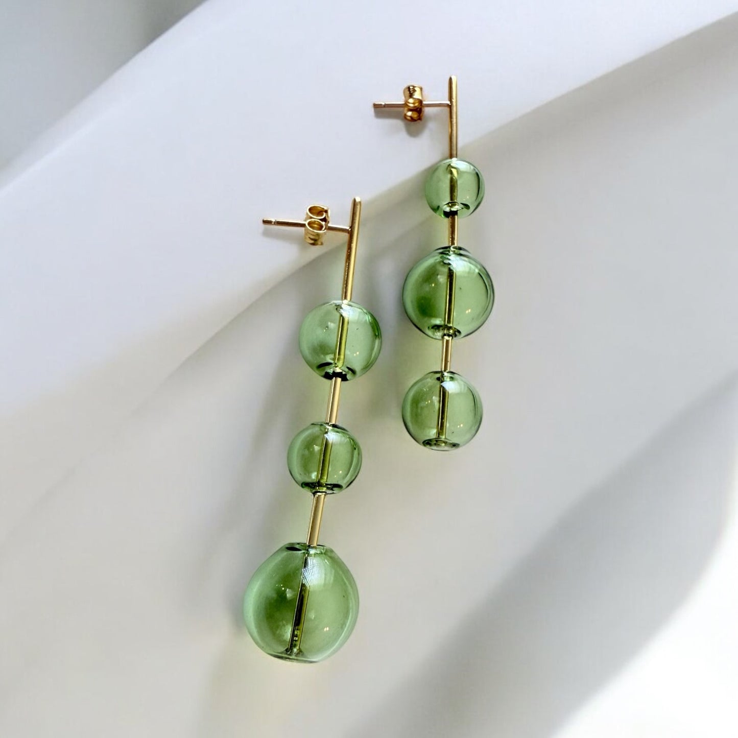mismatched green glass stick studs